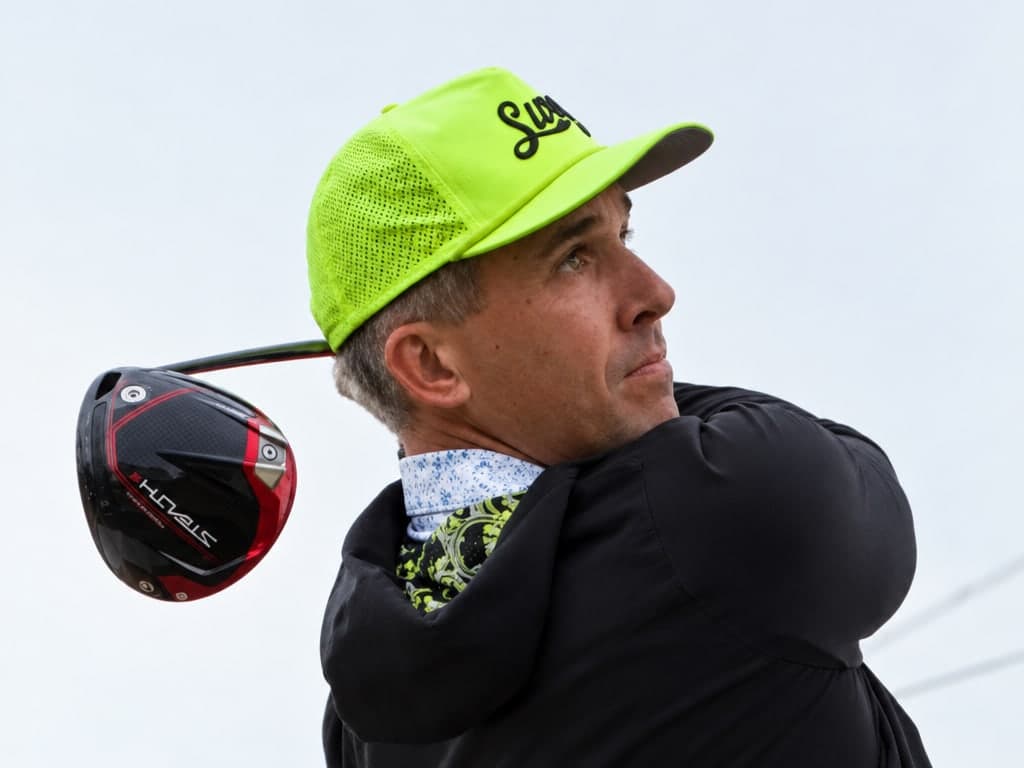 Drew Cooper watching his drive at the end of a full swing