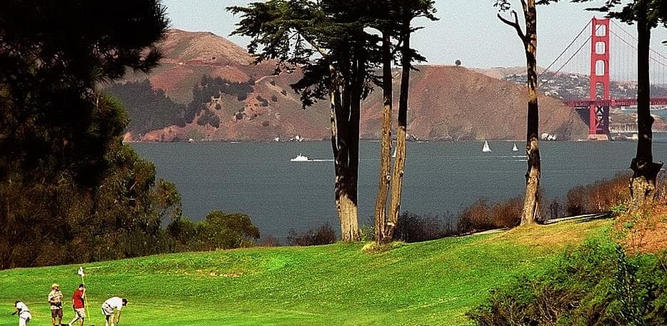 The Golden Gate Bridge and the Pacific Ocean seen from a fairway at Lincoln Park Golf Course in San Francisco