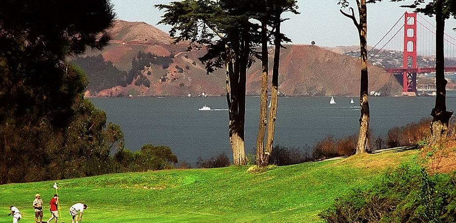 The Golden Gate Bridge and the Pacific Ocean seen from a fairway at Lincoln Park Golf Course in San Francisco